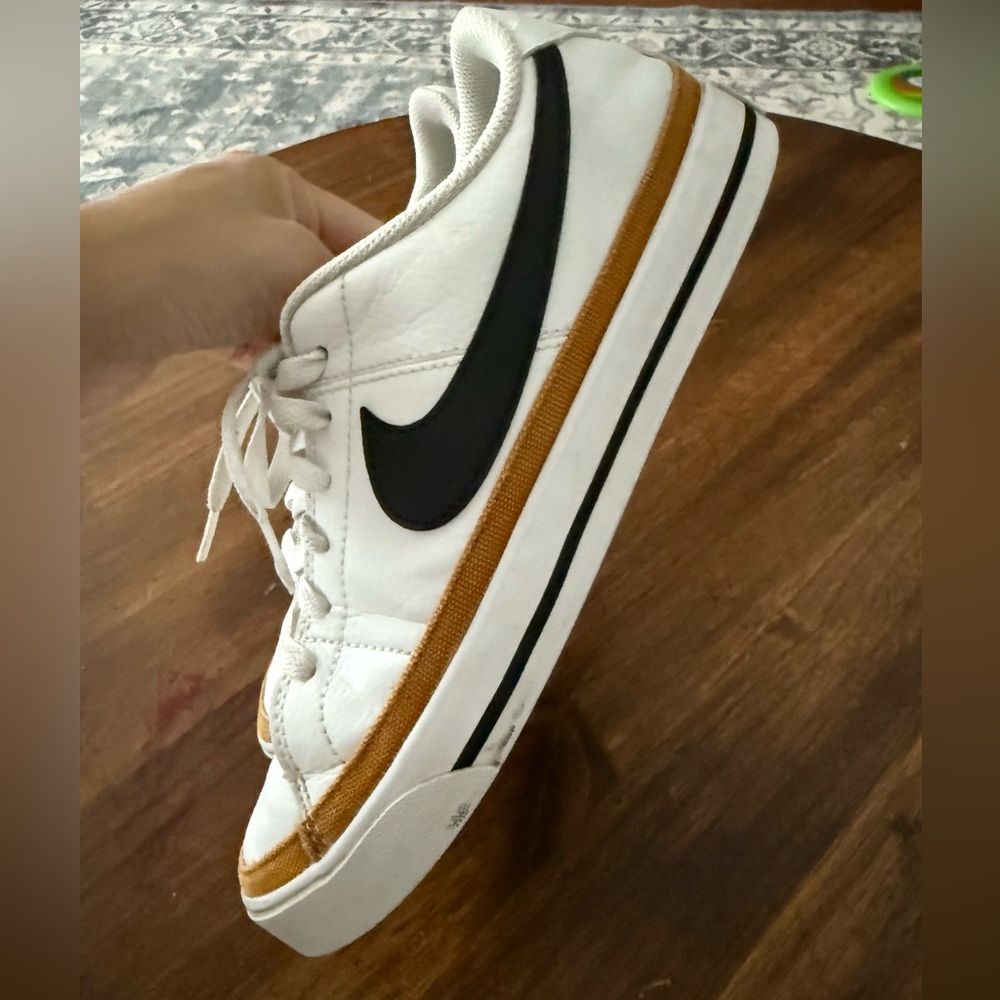Nike White Low-Top Sneakers with Black Swoosh and Brown Trim